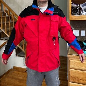 Columbia Men's Vibrant Red Ski Jacket with Black and Blue Accents